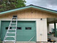 Photos by Alaska's Supreme Painting #8 New siding installed on Upper t-1-11 with new tyvek, cedar trim install