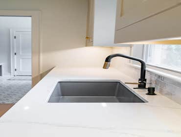 Photos by Albrecht, LLC #1 Through strategic space planning, thoughtful material selections, and custom craftsmanship, this first-floor renovation tran
