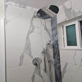 Fine Design Remodeling resume painting, frame, tile, cabinet install, shower, more.