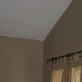 Cut In Brown Wall Against White Ceiling