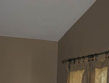 Cut In Brown Wall Against White Ceiling