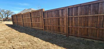 Photos by Keller Fence Contractors #1 Prestain cedar 1x6x8 board on board with 1x4 trim and 2x6 cap and kickboard prestain dipped huemiller classic ced