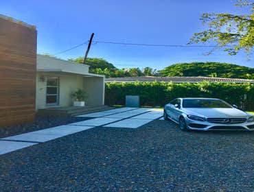 Photos by Driveways by Design #11 Gravel driveway contained by a concrete border featuring Crushed Granite Chips, Designer Concrete Slabs running along