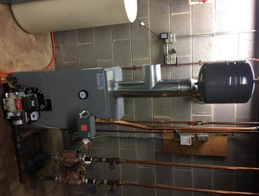 Smith Job Remove 39 year old oil hot water boiler with domestic hot water coil. Install a new Keystone boiler with domestic coil.