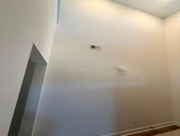 Photos by Mejia Drywall & Painting LLC #1 Wood design on the main entrance wall and on the fireplace of this beautiful house