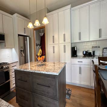 Photos by Lvs Revival Inc #1 Remove existing cabinet design and provide new cabinets. Install new cabinets and granite countertop. Hook up sink and app