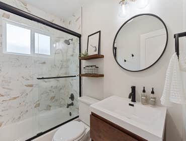 East Bay Bathroom Bathroom remodel in the East Bay. New vanity, sink, tiling, bath/shower, sliding doors, and fixtures.