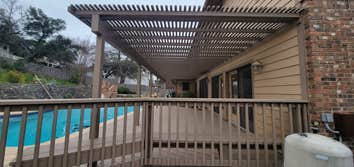 Photos by Rojas Acquisitions LLC #2 Demo out rotted deck and porch, framed in New subfloor and stabilized each rafter, all new pressure treated from fl