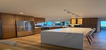Photos by Dreamhome Buliders and Renvoations Inc #1 We completely transformed the old kitchen by installing custom white oak kitchen cabinets, a new co