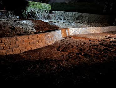 Photos by Lms Construction and Remodeling Retaining Wall Remove existing retaining wall destroyed by fallen tree
Regrade hillside
Regrade lawn
Rebuild 