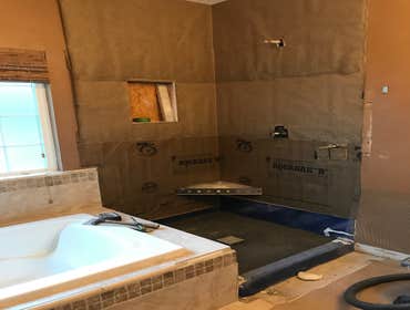 Photos by Griffin Tile & Marble Co #1 Master bath remodel. Remove PVC shower insert , remove separating wall , install new tile shower matching the til
