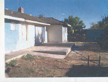 BEFORE PHOTO OF REAR OF HOUSE