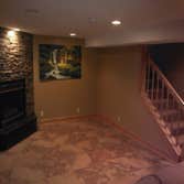 Basement Family Room Created a family room with a fireplace and bathroom in the basement of this home. Also replaced the old stairway with a new easier