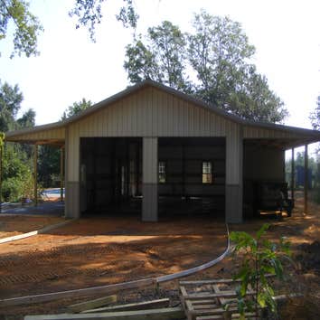 Cooper Job 26' x 48' Pole builing with (2) 12' x 48' lean-tos. Used for garage and pool house.