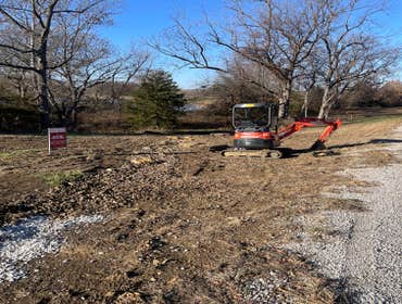 Photos by Spread the Light Homes LLC #3 2 river beds, 1 mile of trench,seed and erosion control