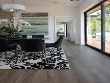 Tiburon house Install hardwood flooring throughout house - wide plank white oak with cured urethane finish