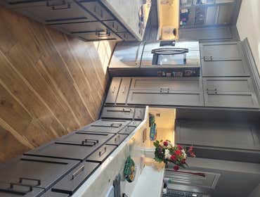 Photos by McLeods Painting #1 High end finish on existing oak cabinets.