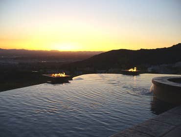 Photo(s) from CUSTOM DERIAN POOLS Infinity Pools, Hillside Pools, Landscaping, BBQs, Outdoor Fireplaces, Shade structures, Pergolas, Landscaping, Mason