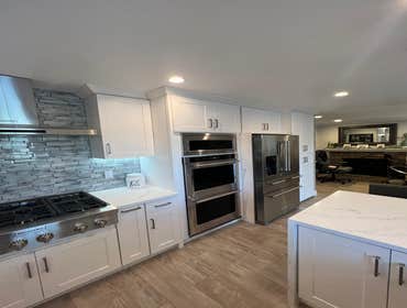 Photos by Us La Home Remodeling Inc #11 Kitchen remodel transformation! Customer made Kitchen cabinets and Quartz countdown tops beautiful glass Backs