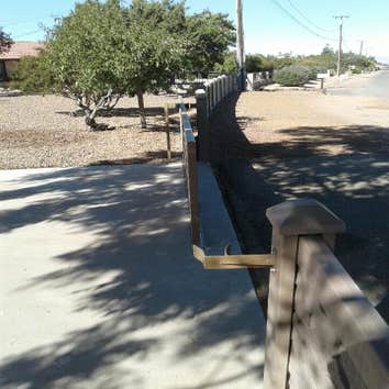 EchoStone Remove wood fence and install new EchoStone with a custom 20ft gate.