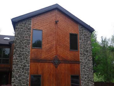 Photos by Innovative Masonry Restoration and Concrete #1 New stone work and cedar planking with pond