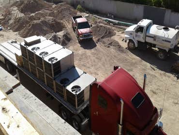Rooftop units being delivered