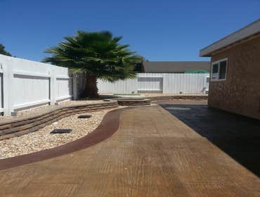 Gainford Backyard remodel Complete tare out and renovate entire backyard with grading stone retaining wall and fire pit, area drains, electircal for l
