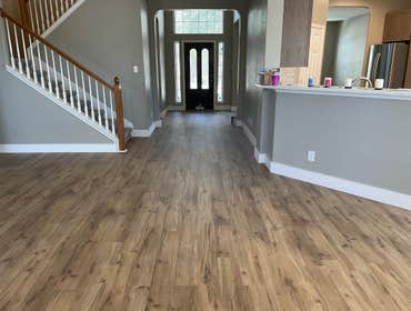 Photos by LTE Remodeling #3 Installed flooring in living room, dining area & kitchen as well as new baseboards where new flooring was installed