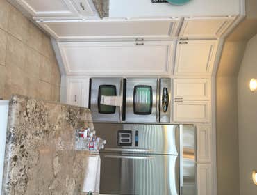 Upscale Transitional Kicthen Remodel New Marble Counter Tops, Updated cabinets, new marble floor, stainless steel appliances, new window with shutters,