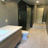 Full Bathroom Remodel Designed and Remodeled entire bathroom. We tiled the floor, made a custom wall mounted vanity, waterproofed the bathroom, and eve