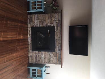 Imperato fireplace and living room Installed neew direct vent fireplace with stone and bamboo flooring with trim