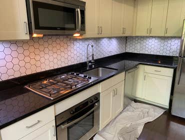 Hexagon backsplash Installed cement backer board, and 3 inch hexagon tiles, grouted, and caulked all transitions