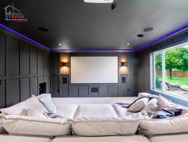Photos by Strong Pillar Construction LLC #4 Custom Basement Finishing included bedroom, bathroom, bar, and movie room