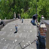flat roof with CERTAINTEED FLINTLASTIC SA and units and vents being flashed