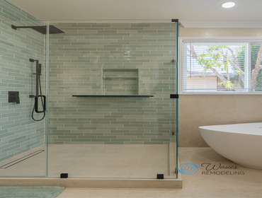 Step into luxury with this complete bathroom transformation by Waves Remodeling. From the sleek walk-in shower and custom wood vanity to the sculptural