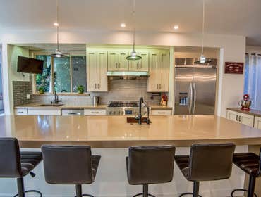 Master Chef Sophisticated Kitchen Design Our focus was to create a fully functional space that meets all our clients' needs. Featuring an island, bar s