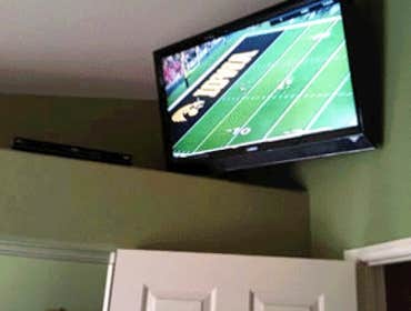 45 inch TV mounted over bedroom door