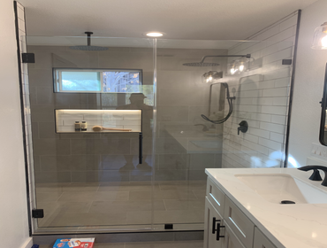 Master shower 8 1/2' by 5' shower. 72" linear drain, bench, 3 shower heads, 3 wands, led backlit shower niches, matte black hardware.