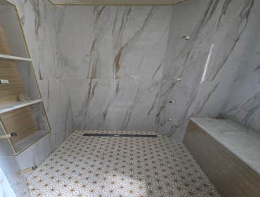 Photos by MC ALISTER TILE #1 5 showers total, was hired after another handyman did not water proof correctly, fixed all water proofing and installed 