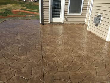 Photos by Stamped Concrete Denver LLC #1 Stamped concrete, often called textured or imprinted concrete, replicates the look of many different stones su