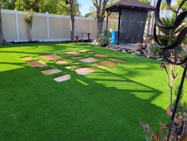 Photos by Jz Synthetic Products #3 Flagstone, with beautiful turf all around..
A great flagstone install with some high quality turf to add to its beau