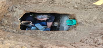 Photos by Bdp Services, Inc #1 Locate septic tank, expose lids to have the tank pumped. After pumping it was discovered that the septic divider wall ne