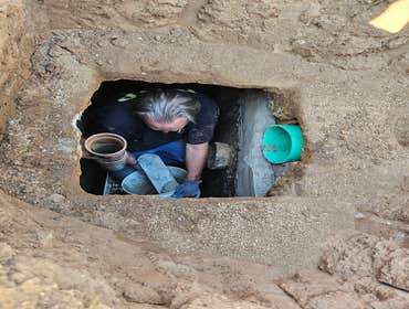 Photos by Bdp Services, Inc #1 Locate septic tank, expose lids to have the tank pumped. After pumping it was discovered that the septic divider wall ne