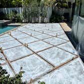 Photos by Ajp Landscape Inc #1 Custom Geometric Concrete with Artificial Turf Inlay
This project features a modern hardscape design with large concret