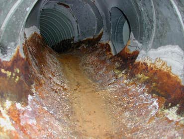 Laguna Residence Home located on the ocean with badly deteriorated galvanized metal ductwork. Photos shown indicated severe deterioration with the fin