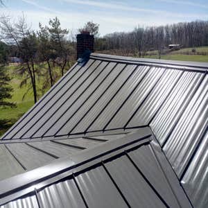Photos by Chris Hernandez Pro-Handyman L.L.C. #2 Slate Roof complete rip and replaced with beautiful Standing Seam.