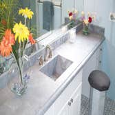 Master Bath Bardiglio Gray and Bianco Venetino Master bathroom remodel with Bardiglio Gray Marble countertops, Bianco Venetino slab shower walls, and A