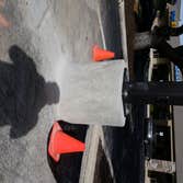 Village Pointe Contracted to remove a pole base, trench electrical runs, drill 8 foot hole for new pole, cast concrete pole, paint (safety)