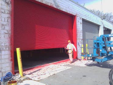 Exterior Painting of Manufacturing Plant One of the crews working on the exterior painting of a large manufacturing plant in Chicago area.