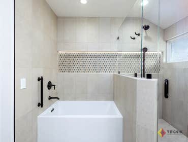 Kept original bathtub. Wainscoting floor to ceiling.